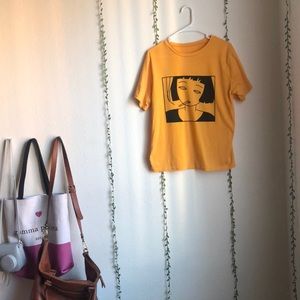 SHEIN burnt yellow “smoking girl” shirt.